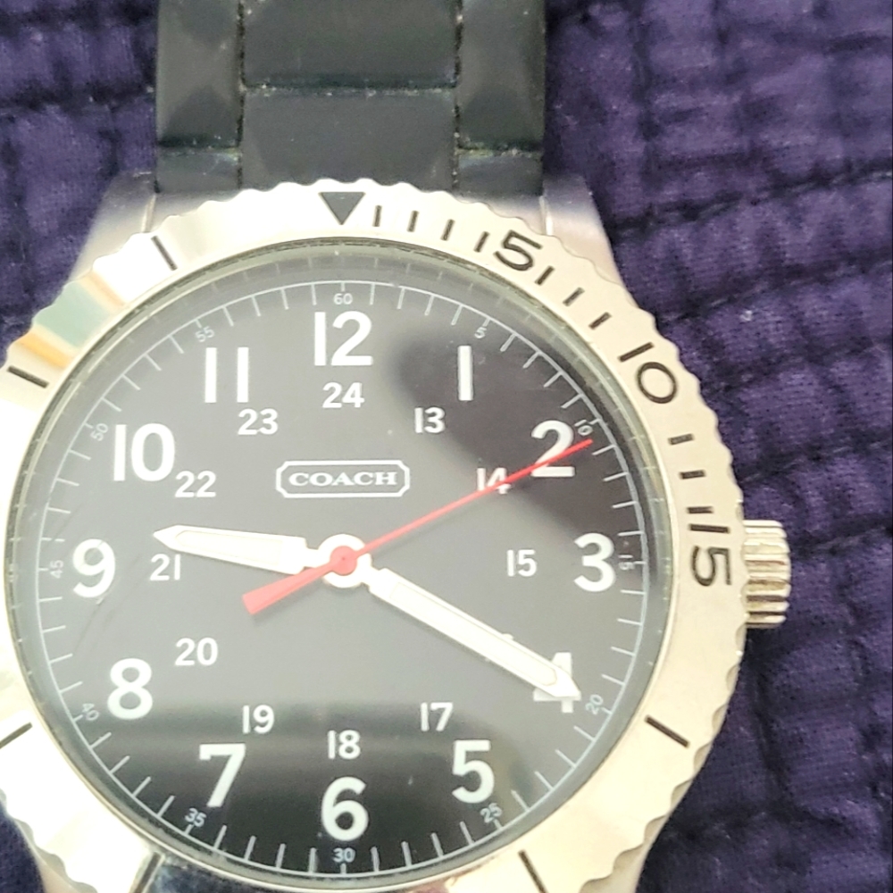 Coach stainless watch with rubber band.